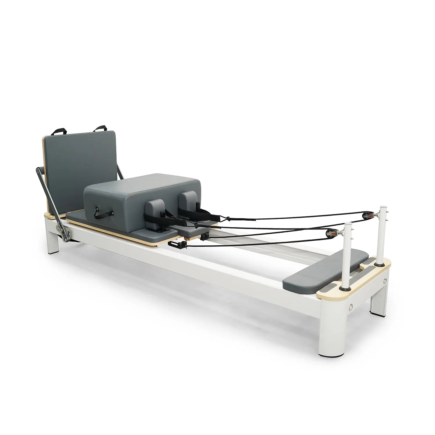Aluna white aluminum pilates reformer with grey upholstery, professional studio grade fitness equipment.