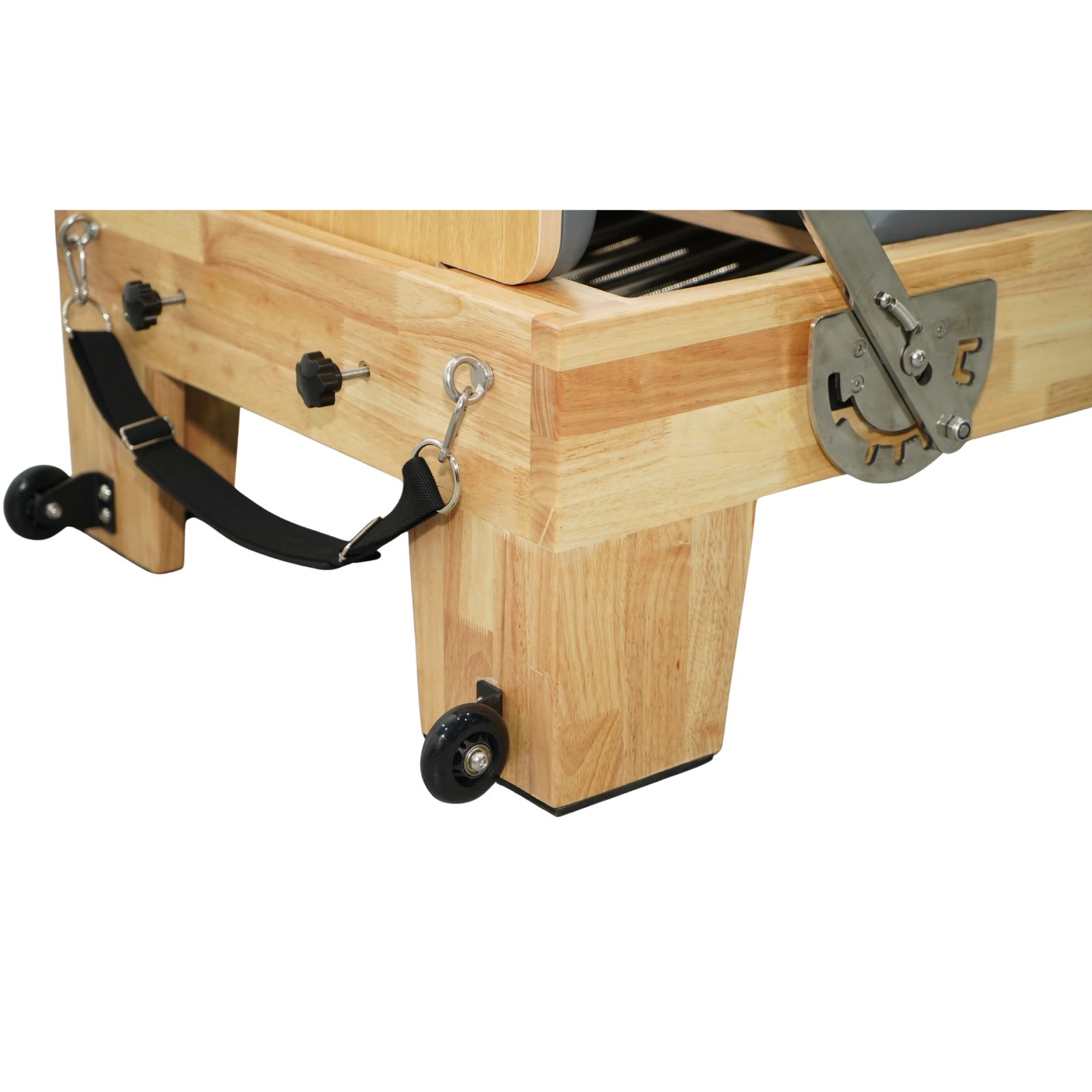 Reinforced oak wood base and transport wheels of Grove reformer, durable craftsmanship for heavy use.