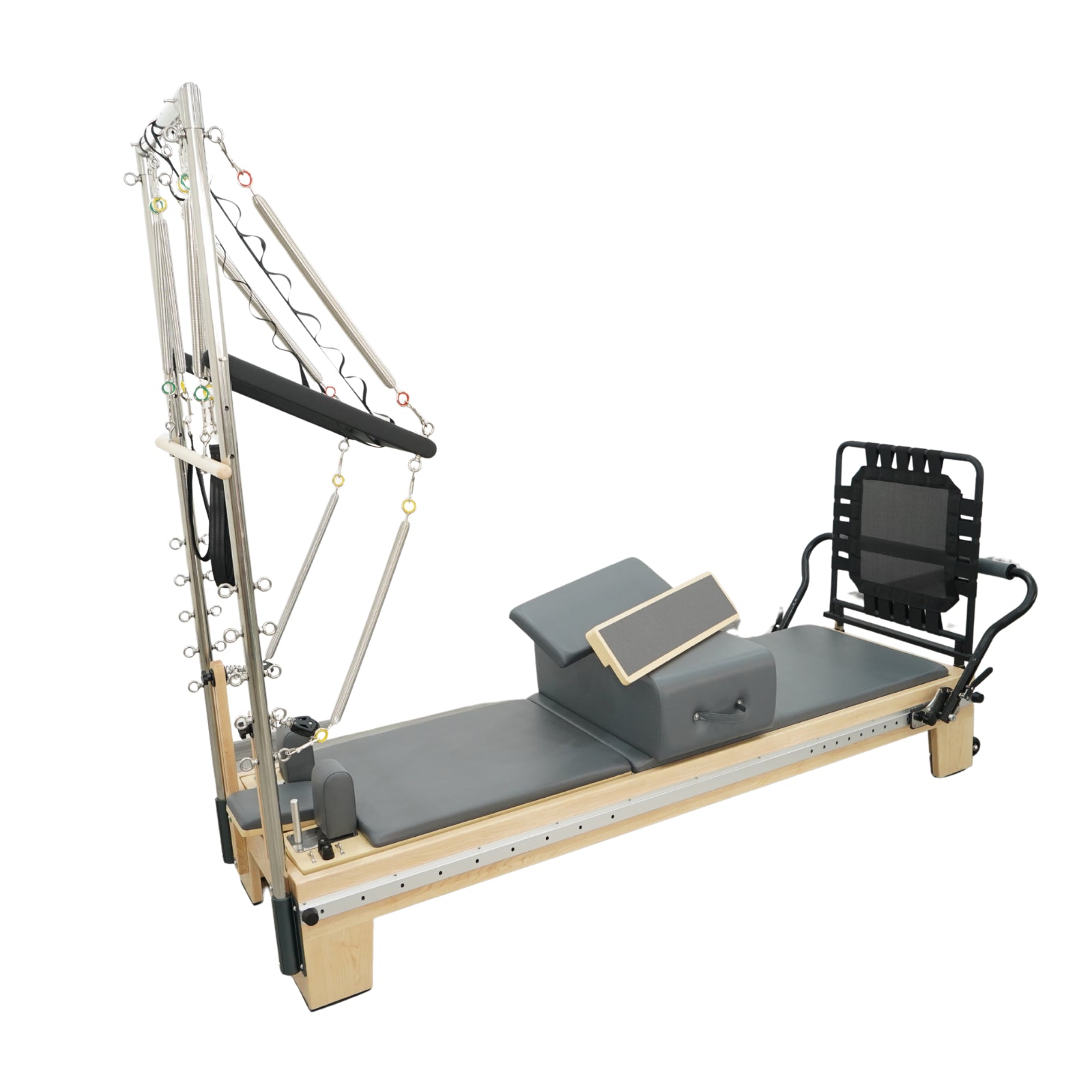 Angled view of Timber Plus maple reformer showing the integrated tower springs and push-through bar system.