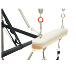 Padded trapeze bar with dual-spring support on the Timber Pro cadillac for advanced aerial pilates.
