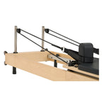 Adjustable pulleys and silent ropes of Nestor maple reformer, designed for professional studio performance.