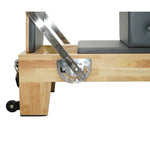 Stainless steel hardware and adjustment mechanism on Grove oak reformer, precision engineering.