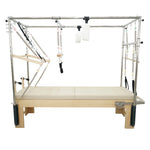 Timber Pro 3-in-1 maple wood pilates cadillac reformer combo with stainless steel trapeze tower and cream upholstery.