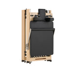 Nestor maple reformer folded vertically, compact storage solution for small spaces and high-end interiors.