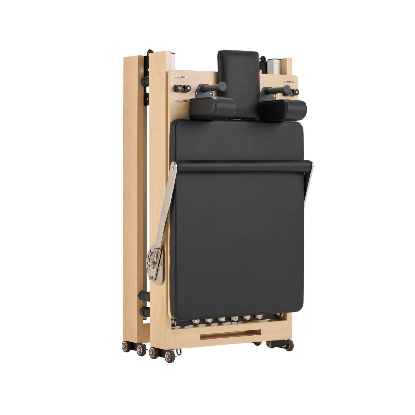 Nestor maple reformer folded vertically, compact storage solution for small spaces and high-end interiors.